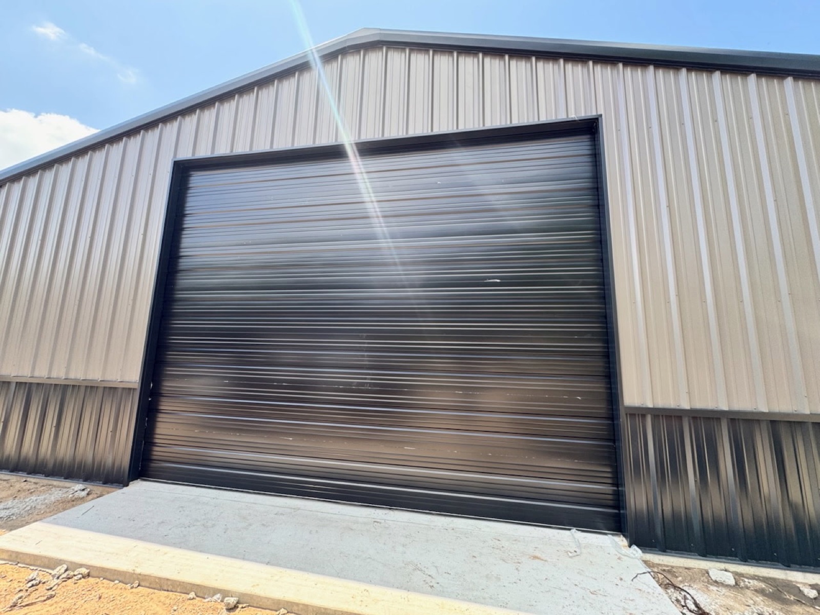 Commercial metal building with an insulated sectional door in North Texas